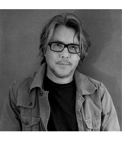 Black and white profile picture of Eric Fan, Author and Illustrator of The Night Gardener and Ocean Meets Sky