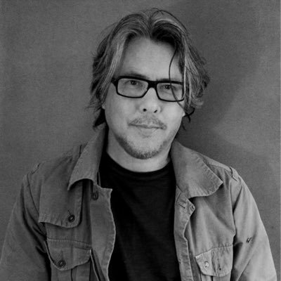 Black and white profile picture of Eric Fan, Author and Illustrator of The Night Gardener and Ocean Meets Sky